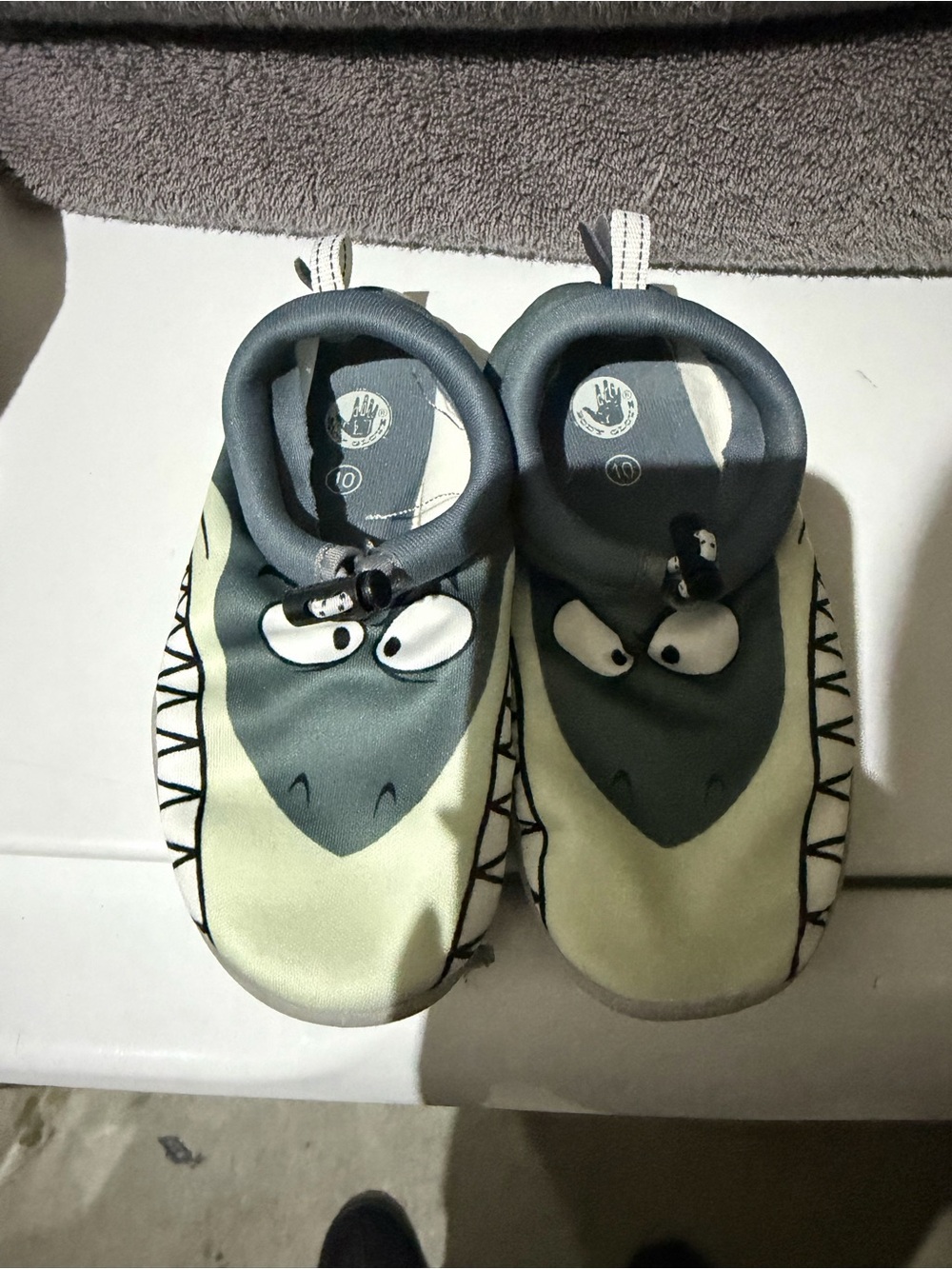 Body Glove kid's water shoes featuring a fun shark face